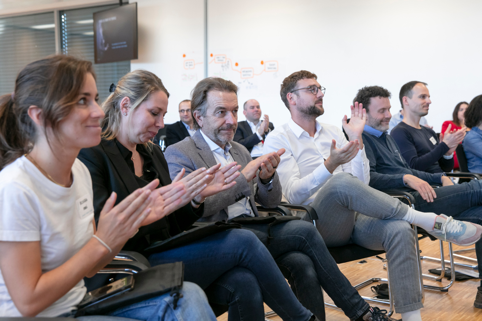 Large group of professionals in a corporate communication training programme